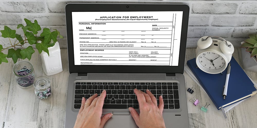 Person applying for job on laptop